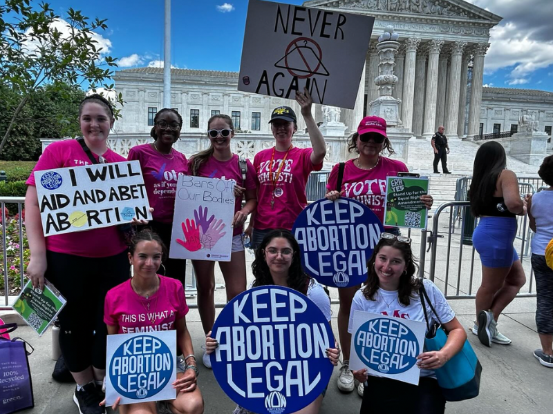 : Interns from Ms. and the Feminist Majority Foundation gather at the Supreme Court on the second anniversary of Dobbs