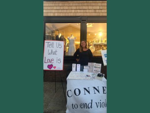 student tabling at the street fair