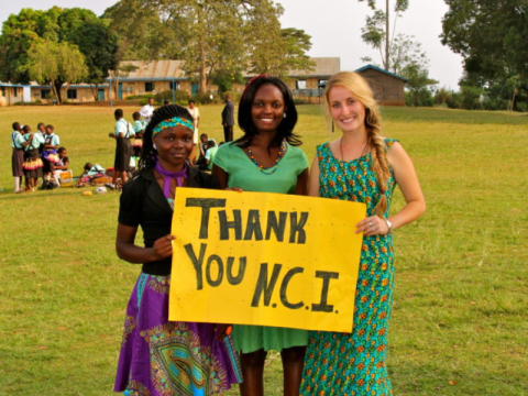 co-workers and Kayla at the end of the Women’s Empowerment MDD Competition.