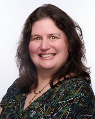 white woman with green shirt and brown hair