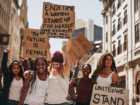 Photo of women protesting with signs