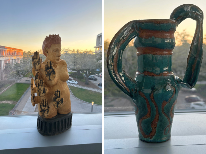 Scuplture of woman with many hands in tan, vase with ribbon like handles in blue 