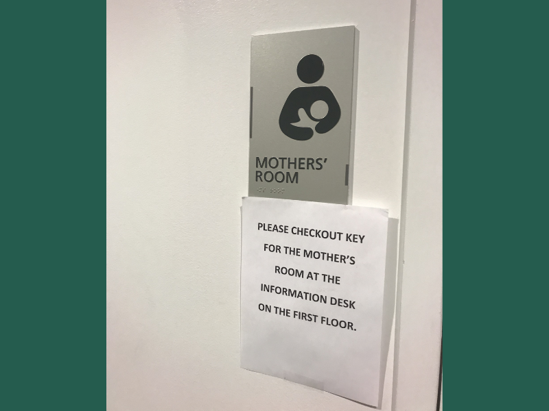 Sign of mothers room with note attached