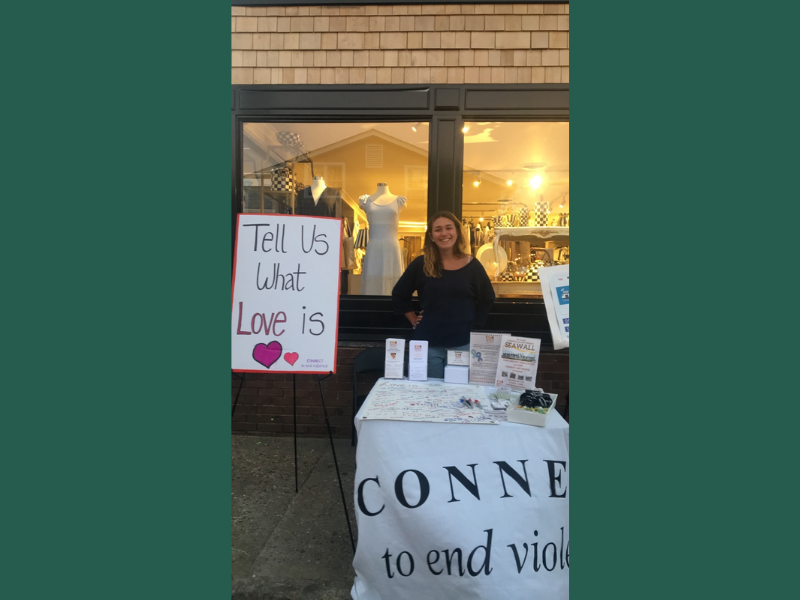 student tabling at the street fair