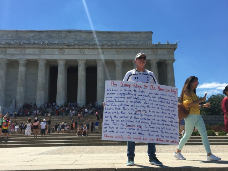 man holding sign in D.C.