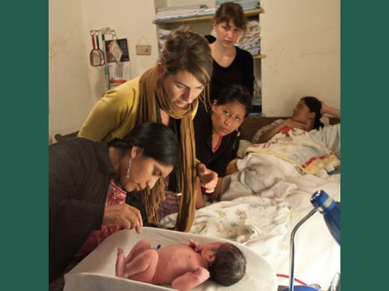 child being tended to by doctor