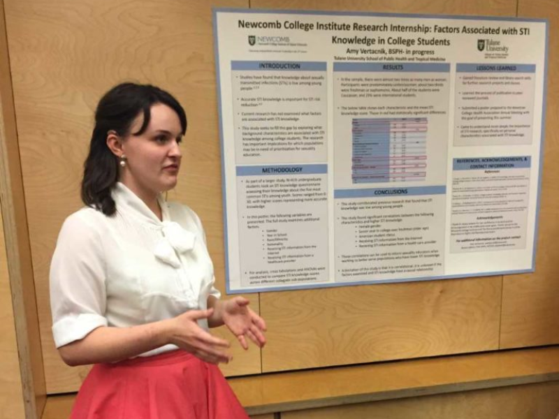 student presenting poster